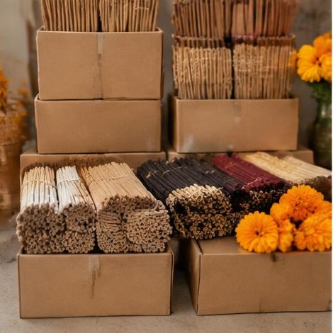 Unlabeled incense bundles and plain cartons prepared for distribution